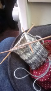 Knitting on the train with snide yarn